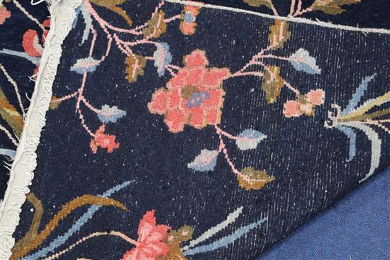 A Tibetan twelve plant rug, 5ft 7in. x 3ft 1in.